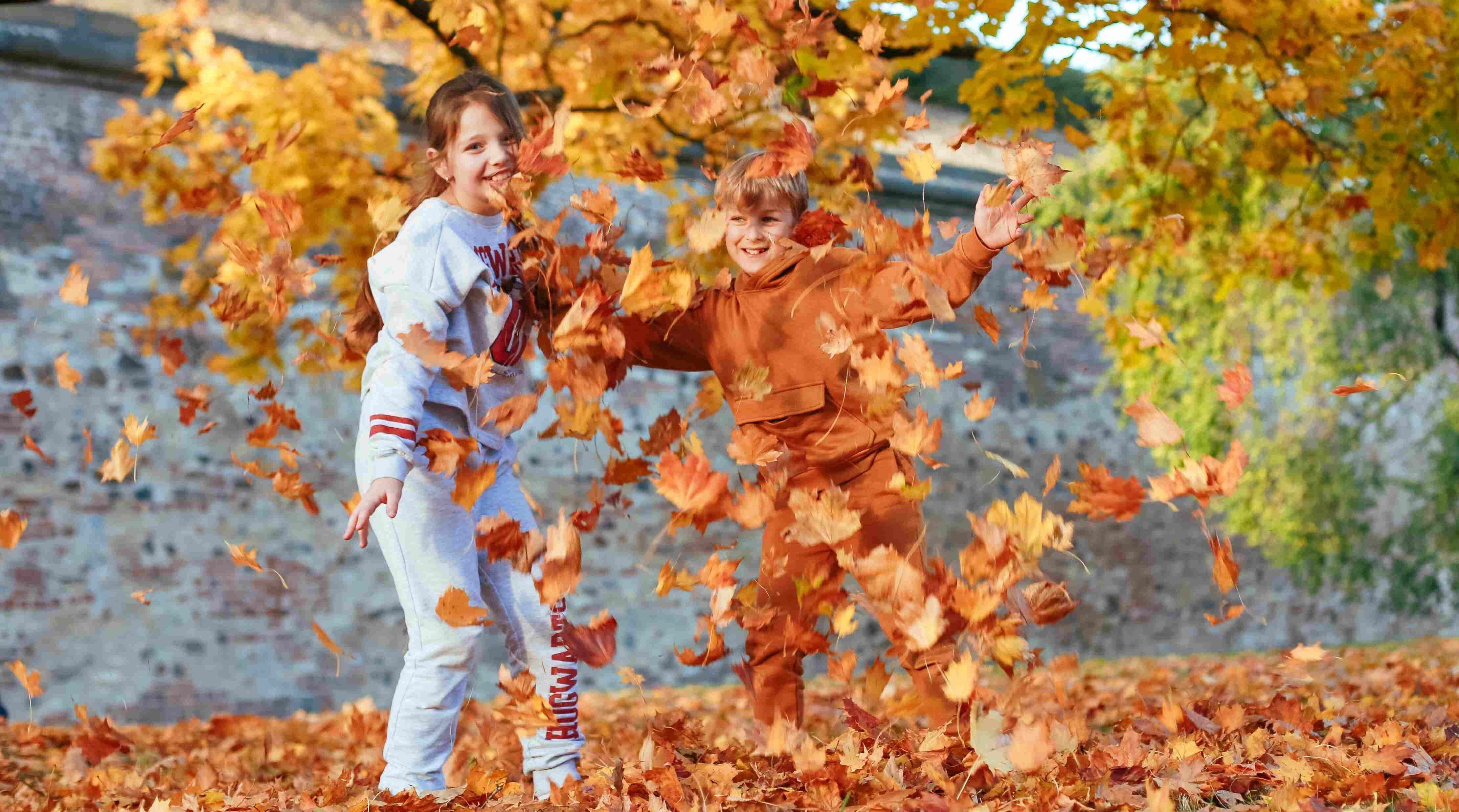 children enjoying in fall weather