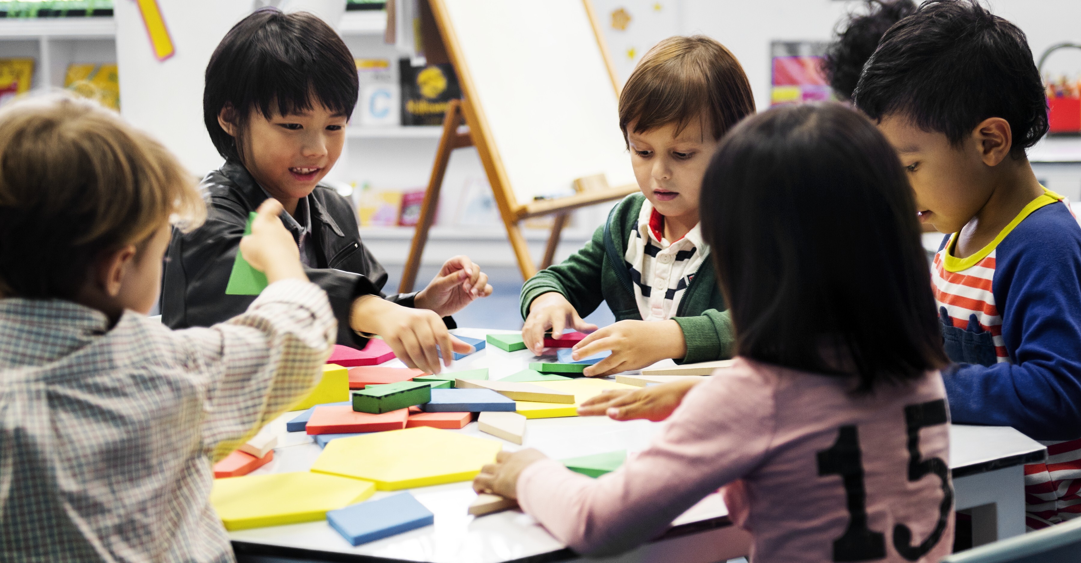 kids playing together at preschool